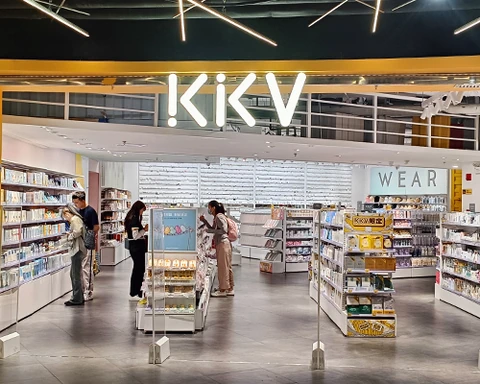 KKV entrance with its illuminated sign and merchandise beyond